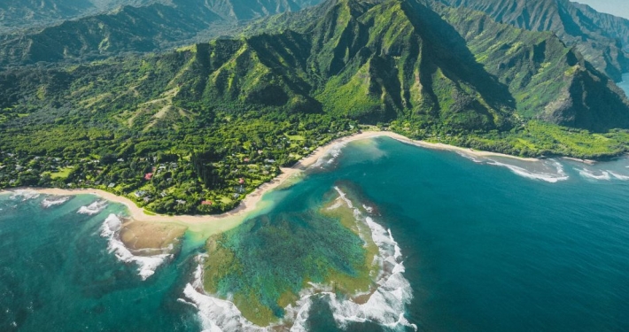 Aerial view of the coast of Kauai where Hawaii SEO can benefit even a small coffee shop overlooking the ocean.